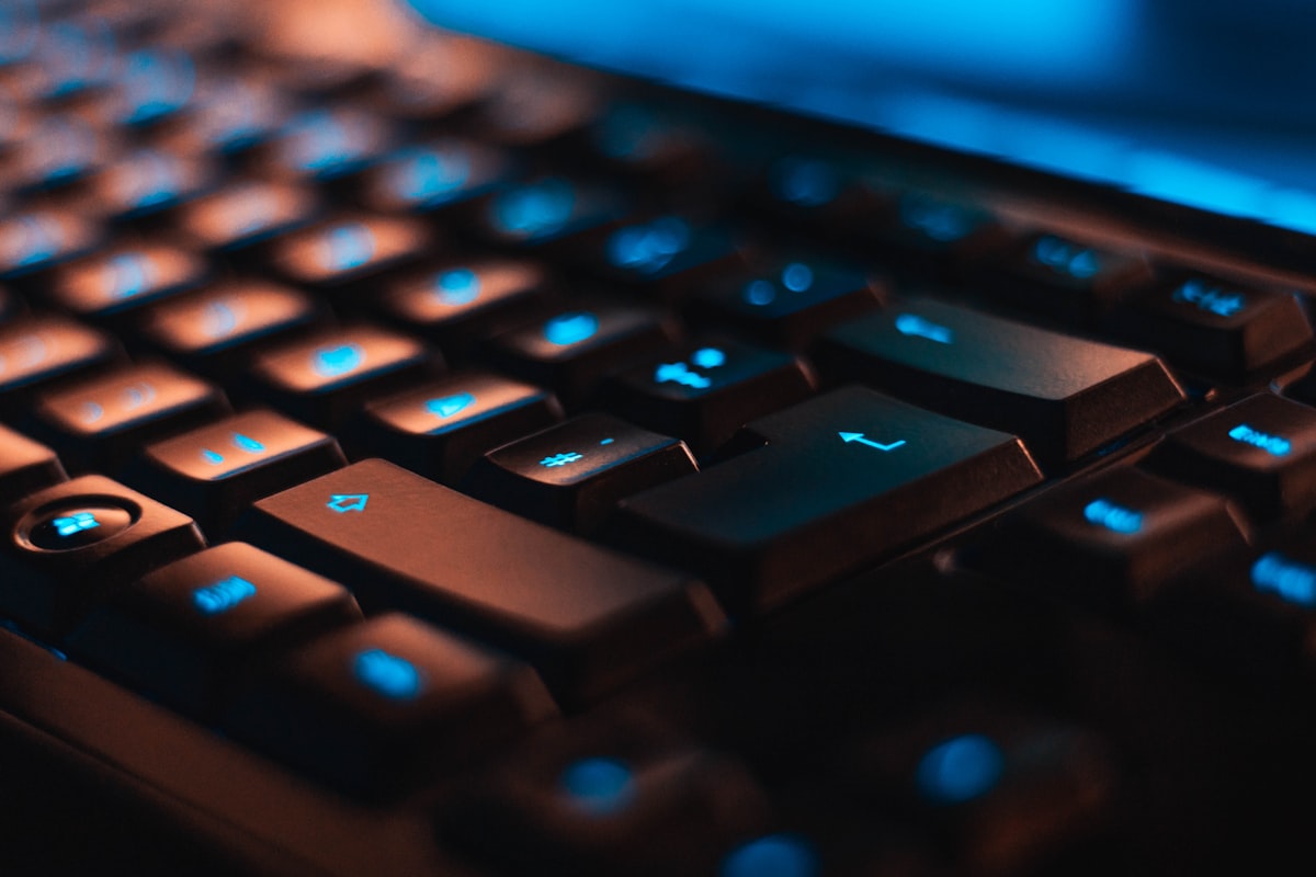 Close-up of a laptop backlit keyboard