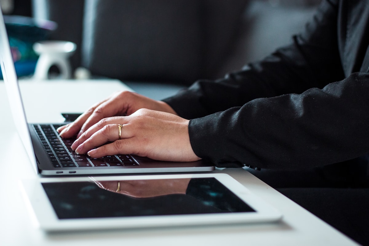 Best Laptops for Lawyers in 2026 A man in a black dress shirt using a laptop