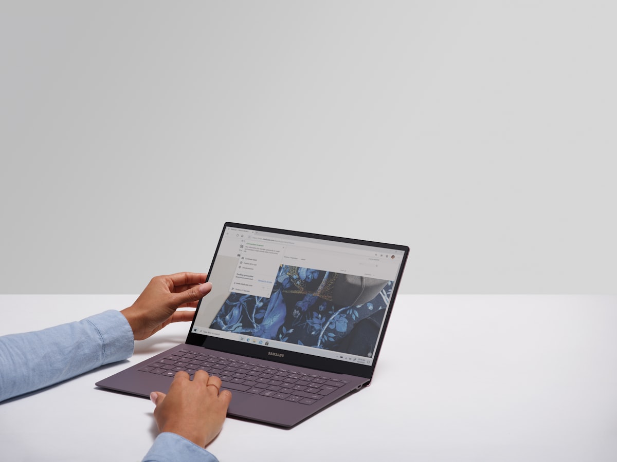 Best 2-in-1 Laptops in 2026 A person using a black laptop computer
